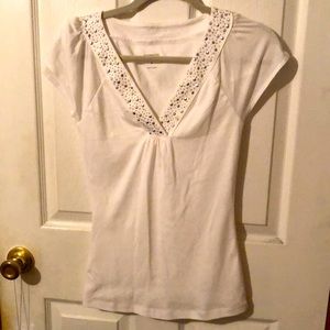 Express top white with studded embellishments on the v-neck
